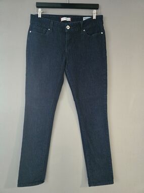 Guess Women's Skinny Jeans in Indigo. Med Rise, Skinny Fit. Blingy Pocket Logo